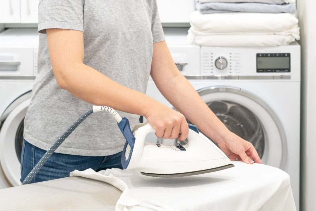 Professional wash and iron service in Delhi with freshly cleaned and neatly pressed clothes ready for delivery
