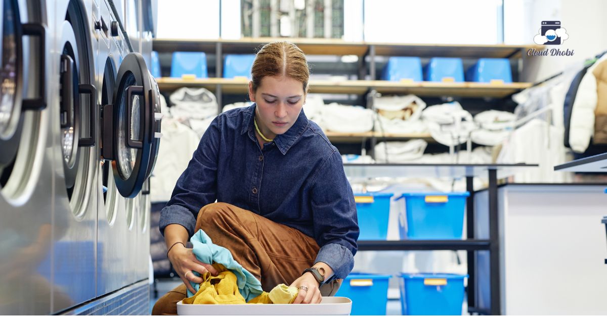 Hands sorting laundry carefully to prevent cross-contamination and germ spread