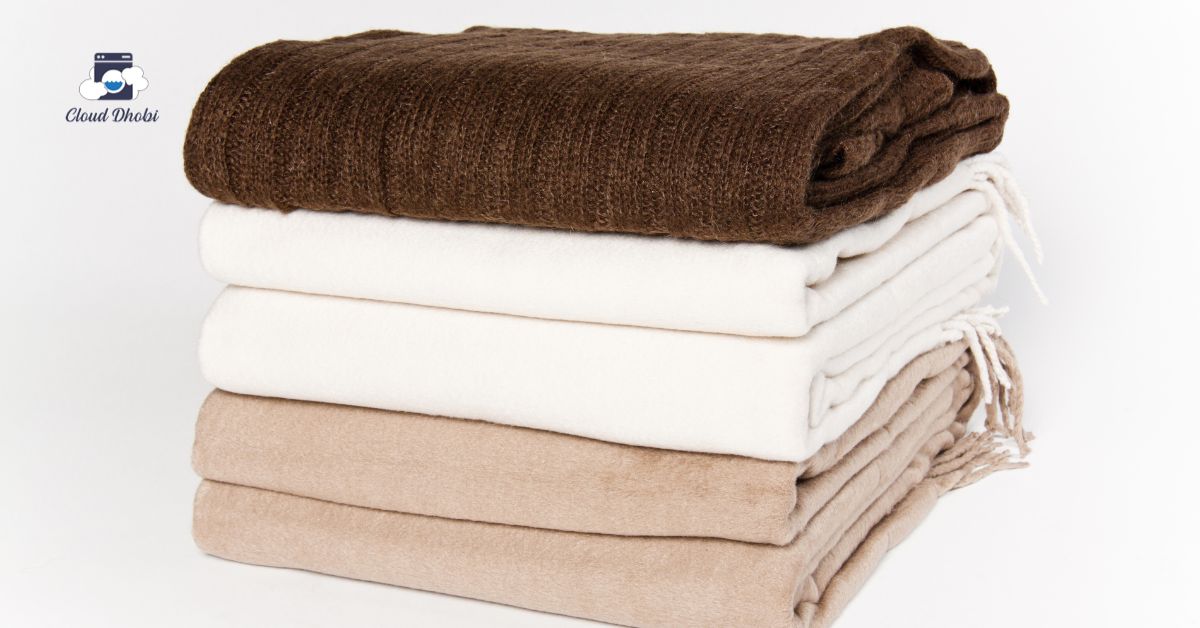 How to wash heavy winter blankets and comforters without damage - CloudDhobi bedding care guide