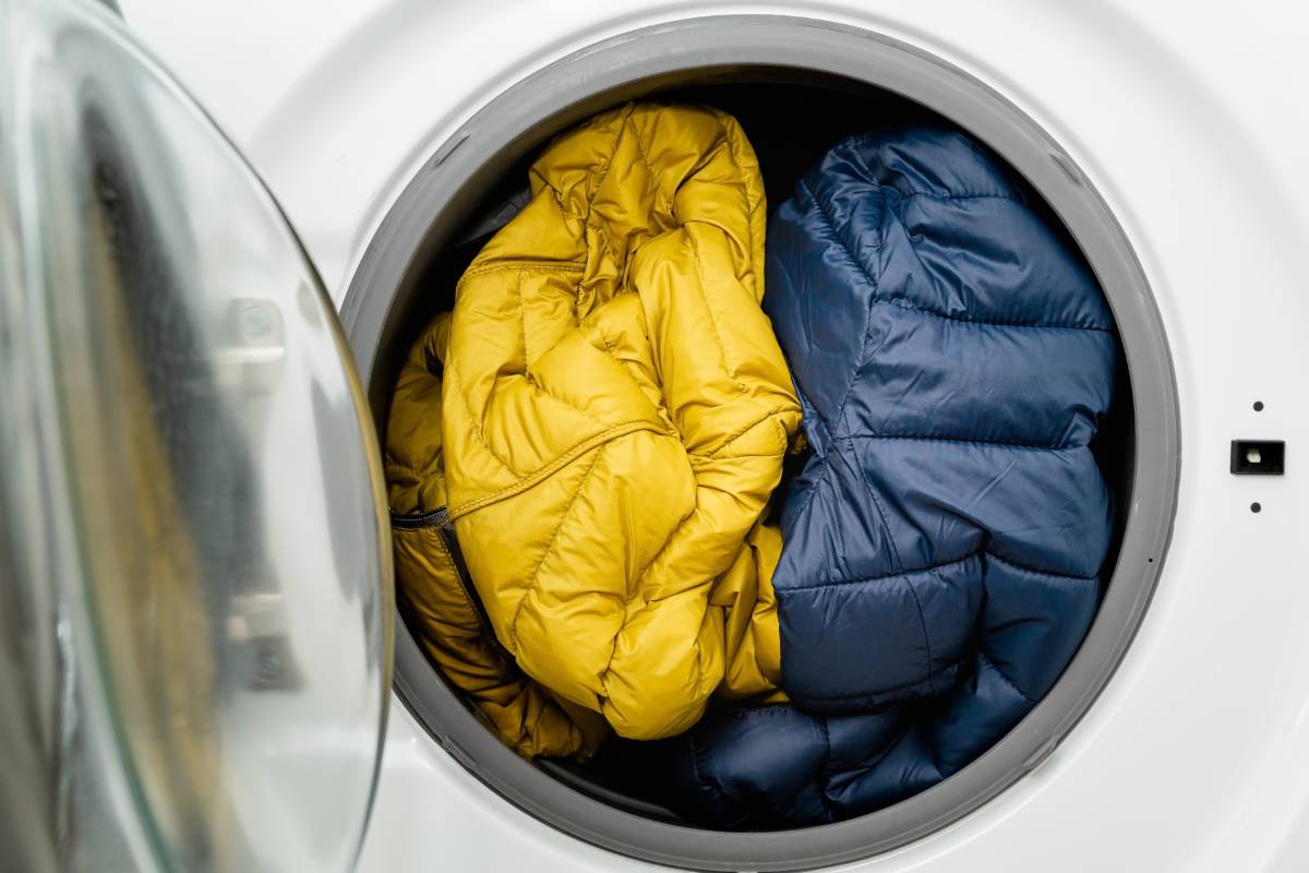 Washing a puffer jacket with soap and water in a home setting