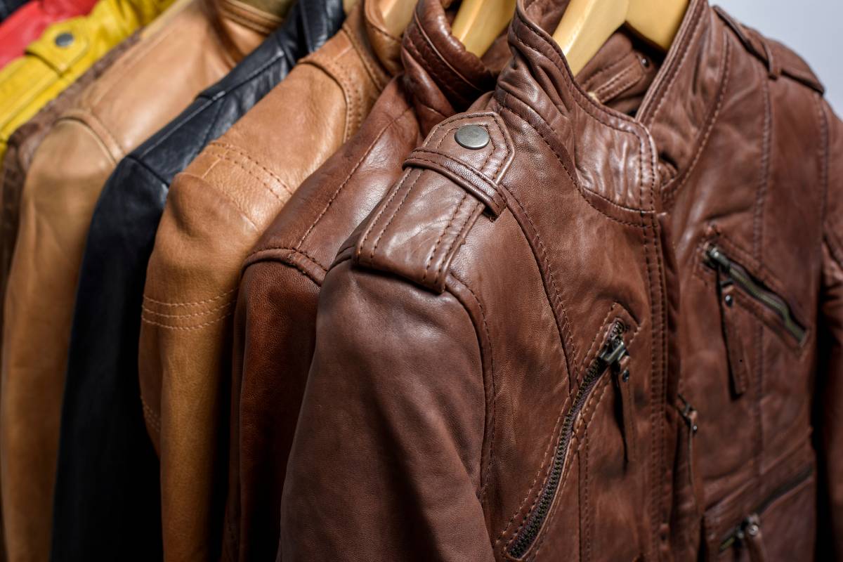 Leather jacket being professionally cleaned in a dry cleaning shop