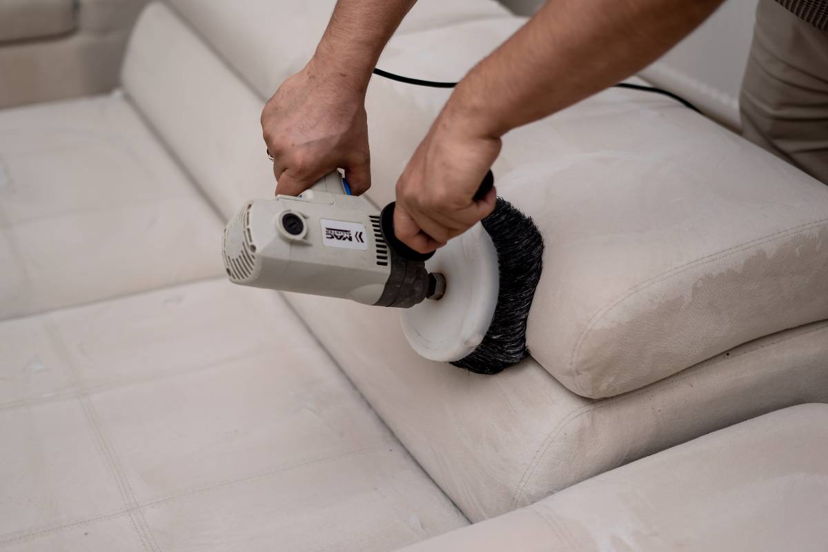 Staff performing sofa cleaning in Delhi reflecting local sofa cleaning rates