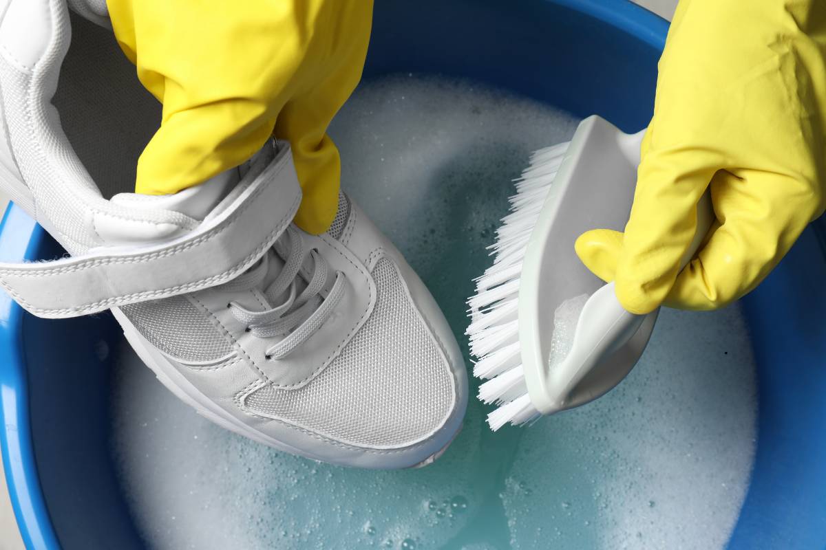 Gently scrubbing white sneakers with care