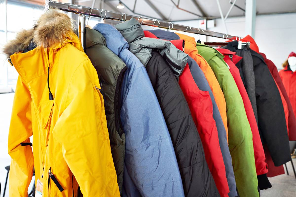 Staff preparing jackets for dry cleaning representing jacket dry cleaning cost