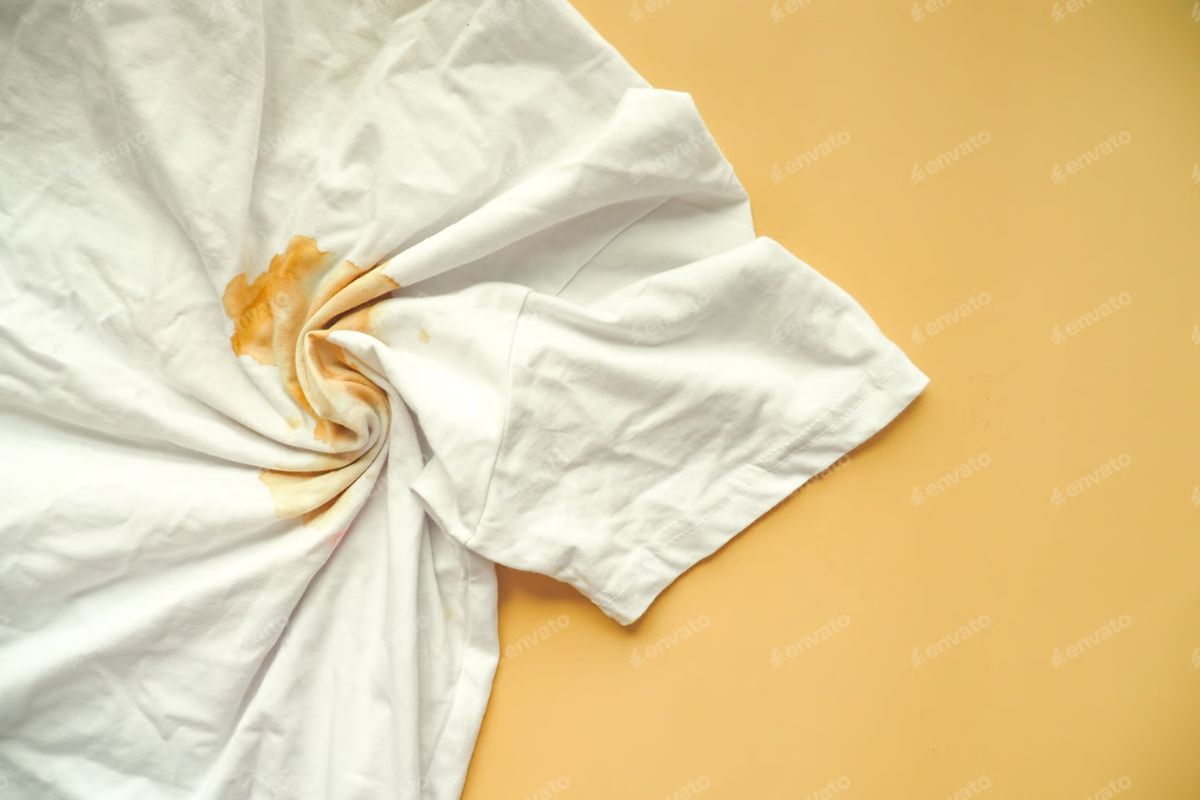 rust mark on white shirt - quality finish after professional cleaning