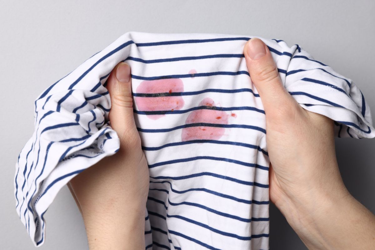 Cloud Dhobi team handling remove wine stains from clothes in Delhi NCR